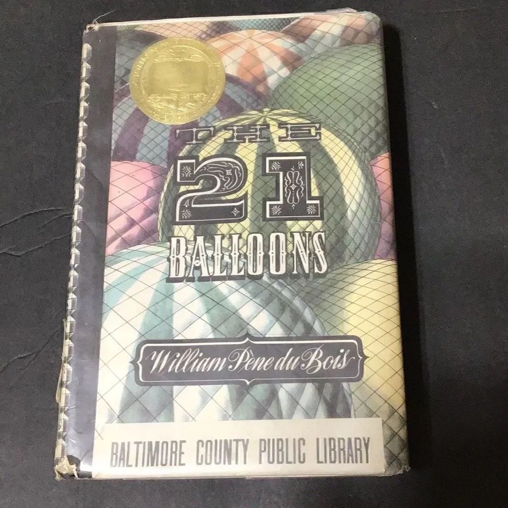 Vintage copy of The Twenty One Balloons cover damage shown